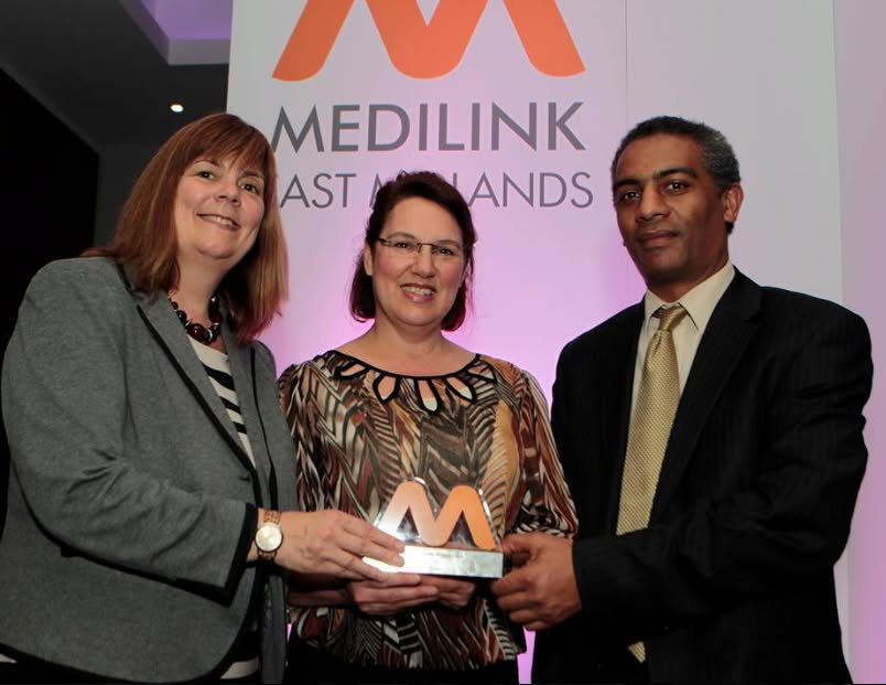 Sam and Debbie with an award